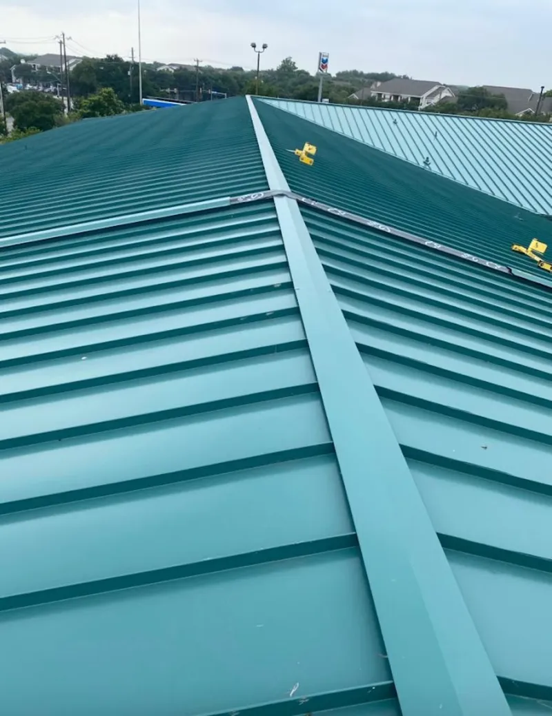 Green commercial metal roof ridge and valley for Metal Roof Repair in Becker